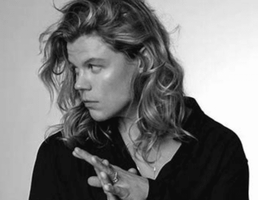 Black and white photo of singer Conrad Sewell