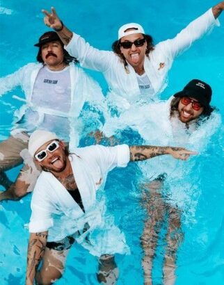 4 members of Coterie in a pool