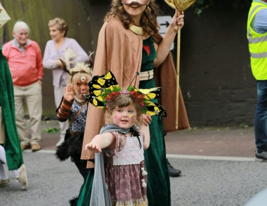 The image of people at kids event