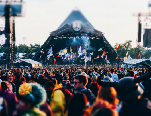 The image of the srage and the crowd of the music festival